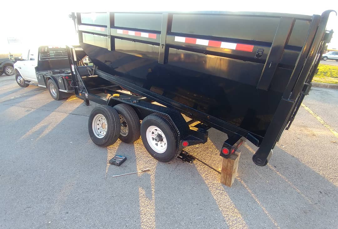 How do you pick up a 7 ton trailer with a 2 ton jack? A bit of dump box leverage. I suppose a screw in the tire in the first hundred miles is my karma for buying a 6th trailer... In other news, this baby doubles as a 13 yard roll off dumpster that will be up for rent to the public or free to anyone that buys or sells a house with me.